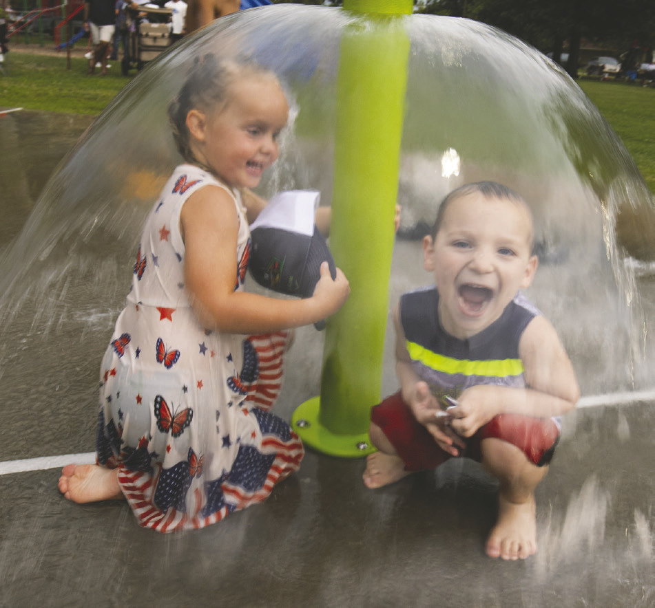 Children beat the summer heat at the splash pad during the annual Crescent Glory Days celebration on July 4. Photo by Brent Fuchs