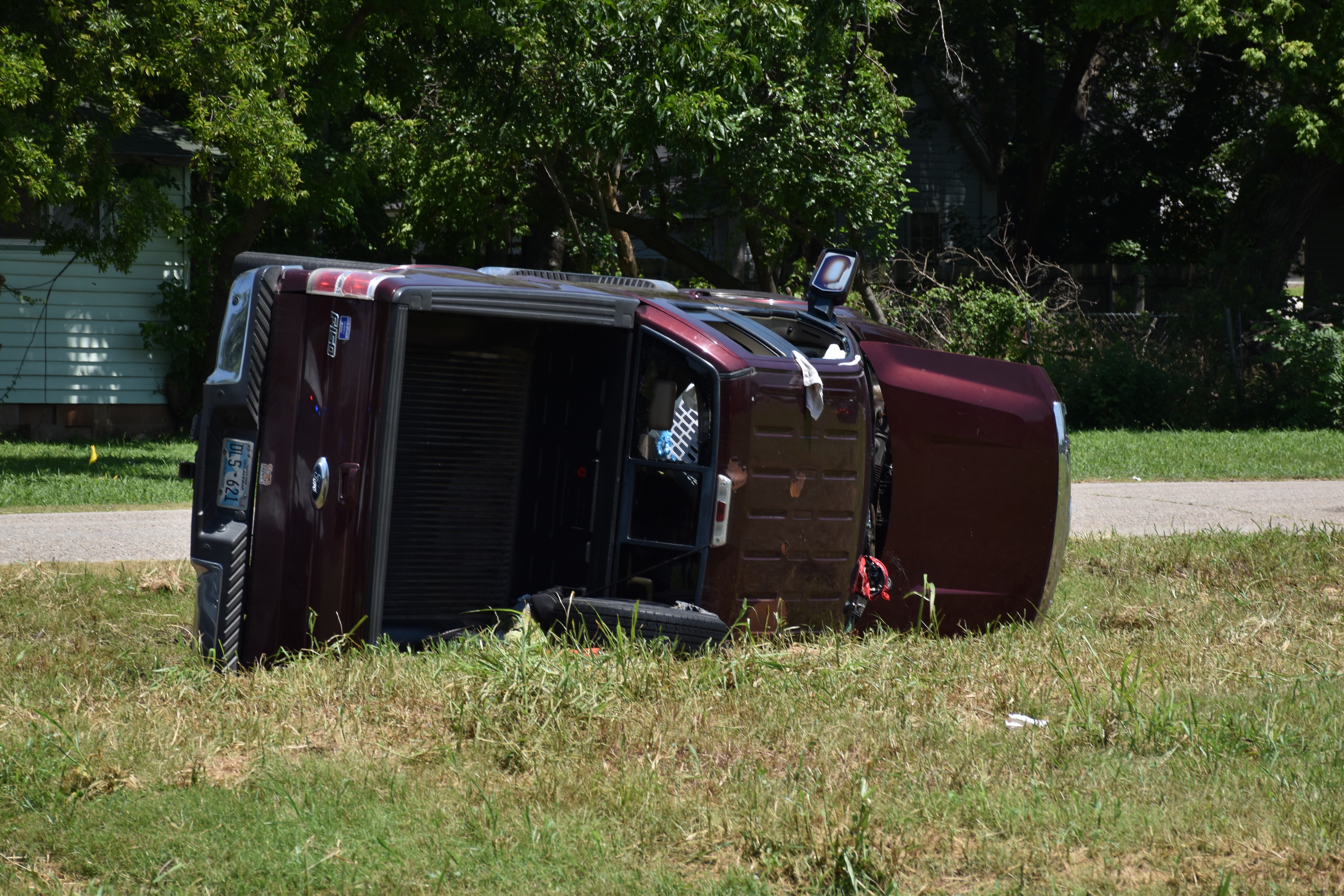 Truck flipped on side at the conclusion of the chase. Picture by Brett Tennyson
