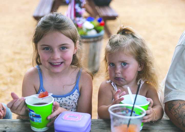 Young attendees enjoy frozen treats during the Downtown Downbeat, which featured family activities, live entertainment and a fireworks display. Photo by Brent Fuchs.