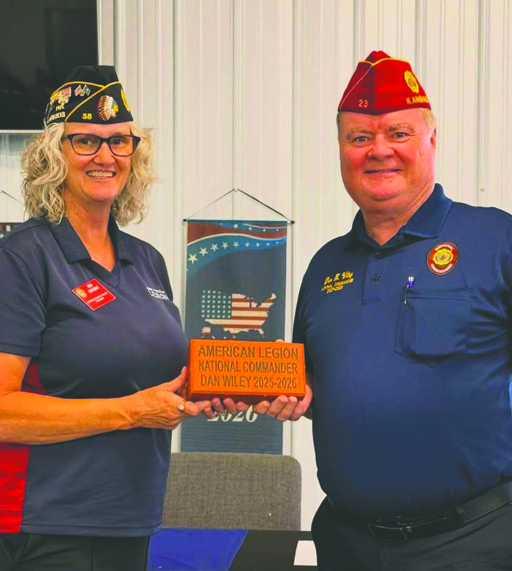 National American Legion Commander Dan Wiley, left, accepts a personalized commemorative brick from Lebron American Legion Post 58 Commander Kim Vincent. The brick was placed in Guthrie’s Honor Park to commemorate Wiley’s service and visit.