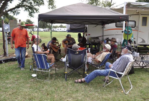 Campers making memories and music before the festival begins. Photo by Nikki Bos