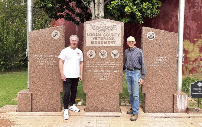 Project Coordinators (L to R) Major Pete Reed and Ron Powell in front of the Logan County Veterans Monument. Submitted photo.