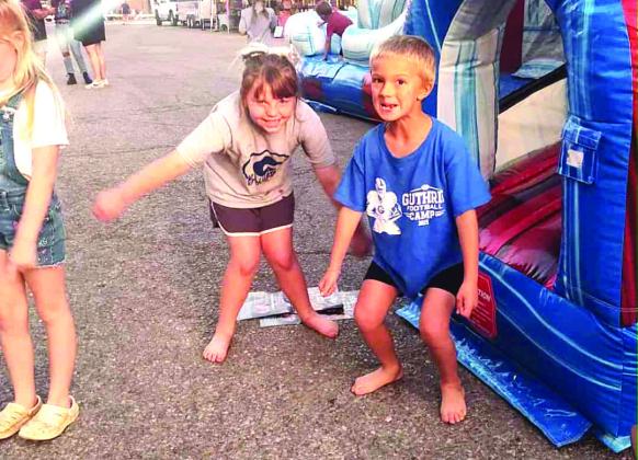 Block partiers enjoying the inflatables. Photo Submitted