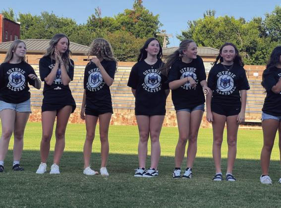 Guthrie Volleyball team members trying to stay out of the sun.