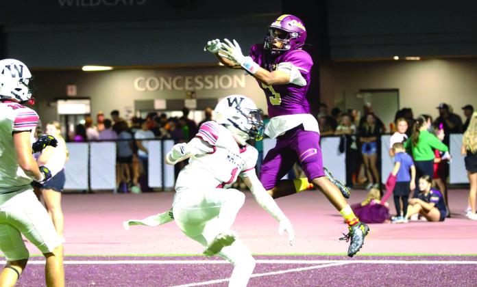 Cashion’s Grayson Davis, who scored a touchdown, hauls in the football in a 42-7 win over Watonga on Friday night.