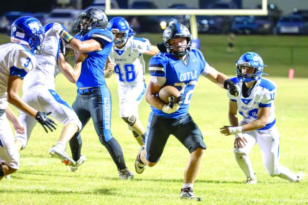 James Lackey, who scored twice for Coyle on Friday night, blasts through an opening as the Bluejackets ran for 286 yards against Depew.