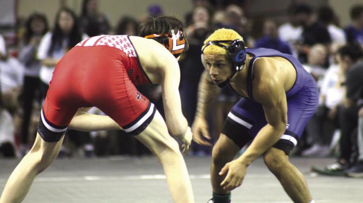 Guthrie’s Kaedin Herendeen wrestles at the 2025 Class 5A State Tournament. Photo by George McCormick.