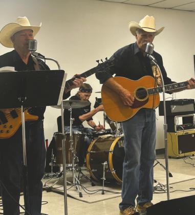 The Wagon Wheel Band performs during the ’89er Days Chuck Wagon Feed at the Logan County Fairgrounds, providing live music and entertainment for attendees. Photo by Shelley Malicote Stutchman