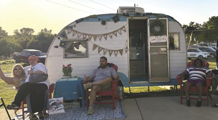 Attendees enjoy a break outside a vintage camper during the sixth annual Hoppy Camper fundraiser at Camp Twin Cedars in Guthrie, supporting the nonprofit camp’s programs. Photo courtesy of Cody Lawson