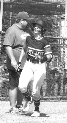 Guthrie Softball Haley Gallo home run trot as Head Coach Booker Blakley looks on.