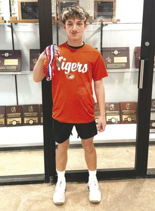 Junior High lifter, Dayone Lupardus with his medal from the State meet on March 14. Photo courtesy of Crescent football facebook page.