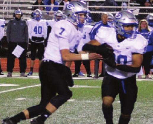 Hayden Calvert hands off to Isaiah Hammons in McAlester