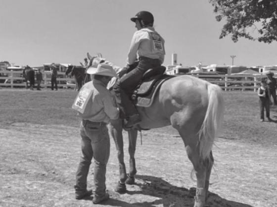 Little Britches Rodeo Finals competitor on horse at Lazy E Arena.