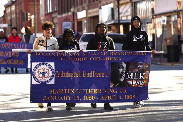 Monday citizens from around Logan County joined in remembering Martin Luther King, Jr. through the Annual MLK Day Service of Remembrance and Parade which happened in Downtown Guthrie. Guthrie’s annual parade began in 1991. After President Reagan signed the federal holiday into law in 1983, and Oklahoma first observed it in 1986. In Dec. 1990, the City of Guthrie adopted Martin Luther King, Jr. Day as an official holiday with the help from the Logan County N.A.A.C.P. Photo by Brett Tennyson