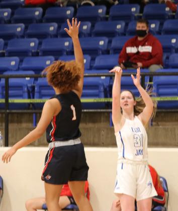 Kyra Wheeler shoots a 3-pointer