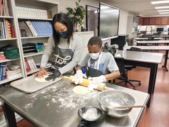 Sherryl Nelson and her son Camdon prepare to enjoy a pizza they made in a recent Homemade Pizza short course at Meridian Technology Center. Meridian has announced new short courses for the summer. Courses ranging from Culinary Arts to School Bus Driver Training courses focus on personal and professional development.