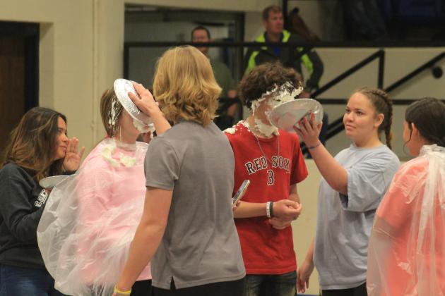 The sophomore class celebrates winning the fundraising competition by pieing the other classes' fundraisers