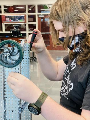 The Meridian Technology Center STEM Academy was named a Distinguished High School by Project Lead the Way (PLTW) for its Biomedical Sciences and Pre-Engineering programs. Pre-Engineering student Dylan Martin makes an adjustment on a VEX Robotics project that he's building.