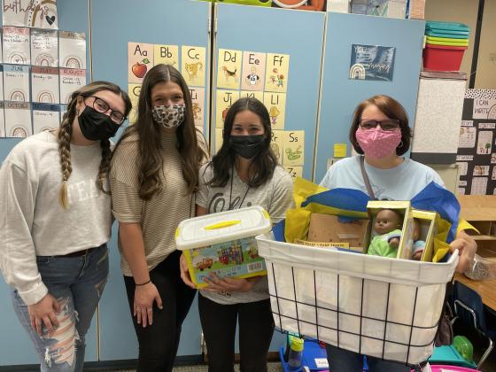 University of Central Oklahoma College of Education and Professional Studies students surprised four metro teachers, all recent UCO education graduates, with classroom supplies as part of its Adopt-A-Teacher program. Pictured, left to right: Zoe Cardenas, an early childhood education major from Yukon, Oklahoma; Kenzie Holland, an elementary education major from Midwest City, Oklahoma; Kitty Stuber, a teacher at James L. Dennis Elementary School in Putnam City, Oklahoma; and, Jill Davis, Ph.D., UCO associate