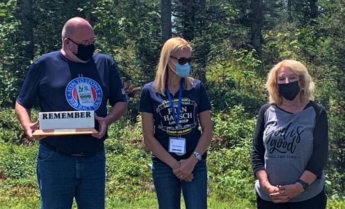 Wreaths Across America Executive Director, Karen Worcester presents The Fran Haasch Law Group with the WAA Remembrance Award. (Photo courtesy of WAA Staff)