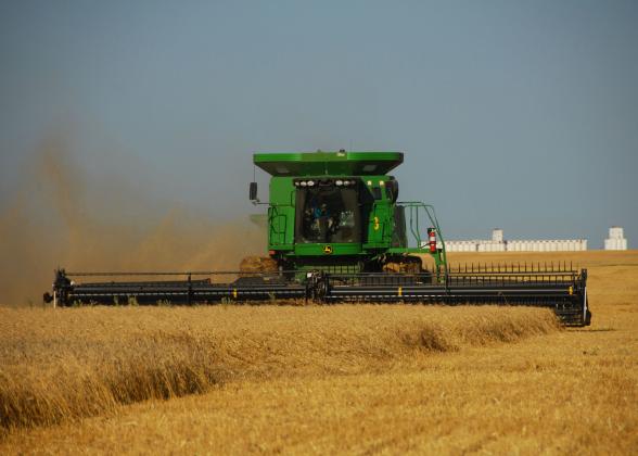 Oklahoma’s annual wheat harvest is an agricultural activity that benefits from knowing custom rates for a given area. (Photo by Todd Johnson, OSU Agricultural Communications Services)