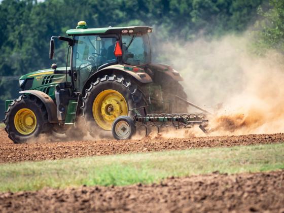 Dust flies as a tractor prepares a dry field for wheat to be seeded. (Photo by Todd Johnson, OSU Agricultural Communications Services)