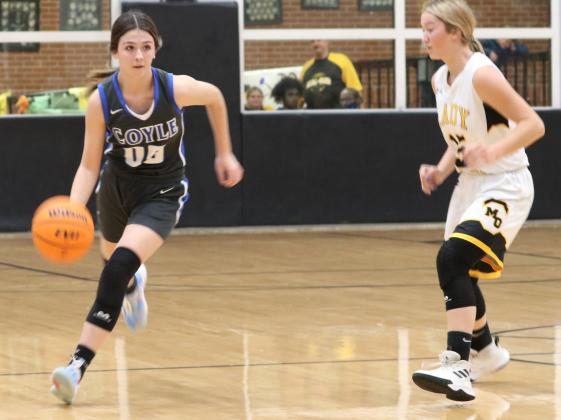 Coyle's Grace Balsiger drives the ball up the court against The Lady Panthers' Kaitlyn O'Neal