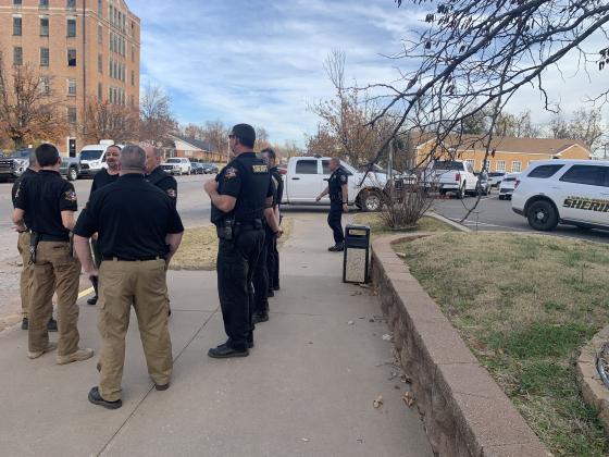 Sheriffs outside the Logan County Courthouse