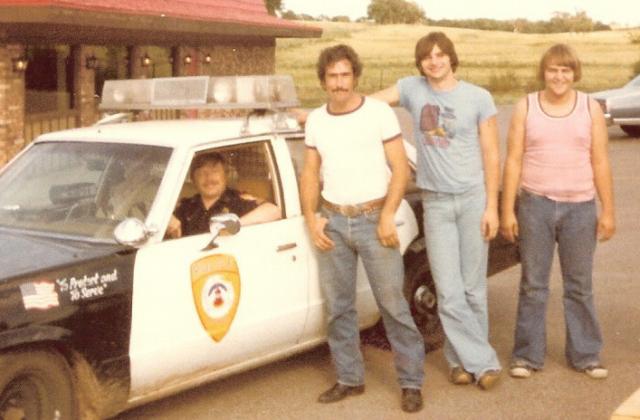 L to R: Jim Daves in police car, R.D. SK President , H.R. V.P.,  Donnie C. secretary (1981)