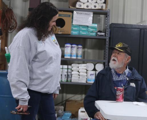 Melissa Fessler talks with retired driver John