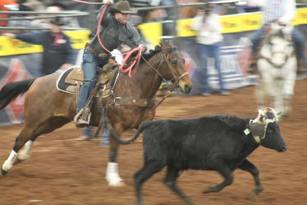 The team roping competition at the 55th International Finals Rodeo at Lazy E Arena in Guthrie. Taken by George McCormick.