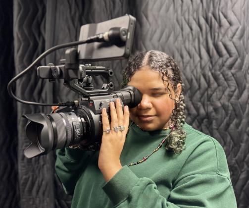 Guthrie High School Junior Jameelah Ramirez explores her creativity behind the camera, filming with professional video equipment in Meridian’s Digital Media program.