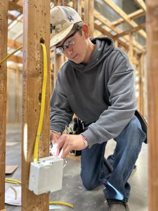 Ryan Hall, a Guthrie High School Senior, sharpens his skills in Meridian’s Electrical Technology program with hands-on learning that prepares him for the workforce.