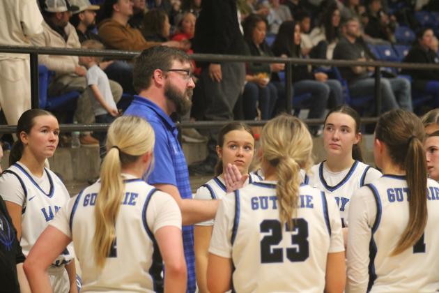 Guthrie girls' basketball coach Joshua Smith coaches his players during a timeout against Claremore, Jan. 31. Taken by George McCormick.