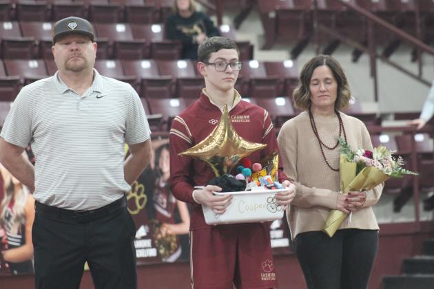 Cashion wrestling senior Cooper McGuire with his family on senior night. Taken by George McCormick