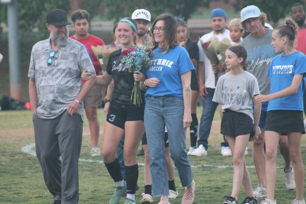 Guthrie's Lilliane Neptune joined by family on senior night, Tuesday, April 22. Taken by George McCormick.