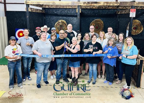 Ribbon Cutting at Dueling Axes. Photo submitted by Heath Shelton of Shelton's Photography