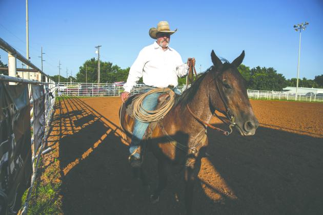 Bobby Kane works from horseback in the arena during the Guthrie Youth Rodeo on Saturday at the Logan County Fairgrounds.