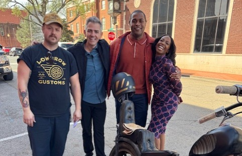 Cast of the Spotlight visit with motorcycle owner in downtown Guthrie.