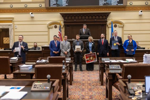 Sen. Chuck Hall, R-Perry, welcomes a group of Guthrie leaders to the floor of the Oklahoma Senate. (from left to right) Pictured are Rep. John Pfeiffer, Rep Collin Duel, Kathy Hayes' son Cooper, Kathy Hayes, City Manager Eddie Faulkner, Mayor Adam Ropp and Guthrie Chamber of Commerce President and CEO Brittany Timmons.