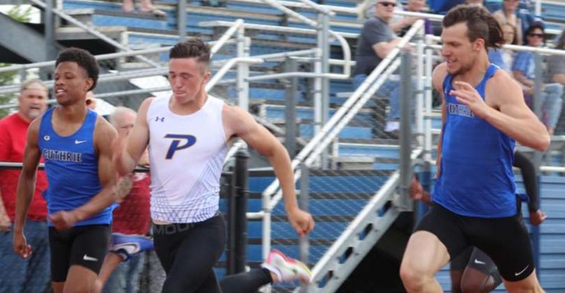 Photos by Mike Monahan Jaylen Chelf’s Piedmont’s William Geiger and Mason Tilley in 100 meter race