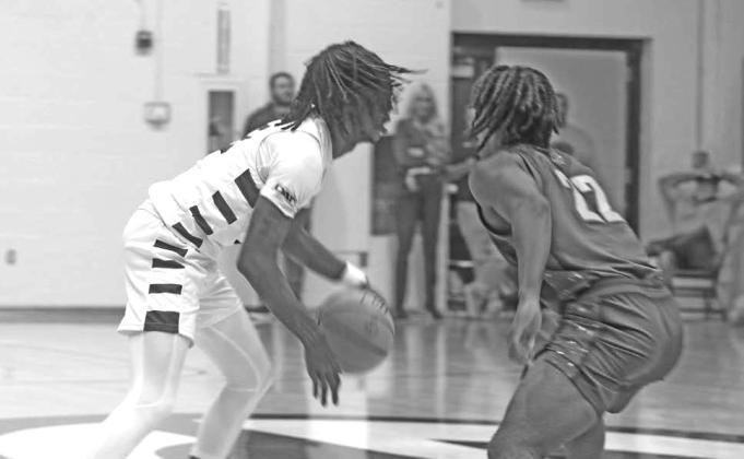 Guthrie’s Tyronne Beatty takes on Carl Albert’s Quincy Hopkins.