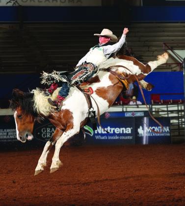 Brody Dent in the junior saddle bronc competition at Lazy E Arena. Courtesy of the World Champions Rodeo Alliance.