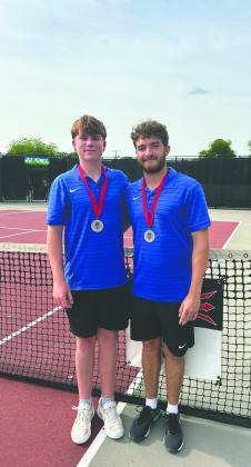 Guthrie boys tennis players Jaxson Mayer and Carson Olmsted pose after winning the Southwest Conference championship in Duncan. The duo captured the title with a third-set victory in the finals. Photo courtesy of Guthrie Tennis