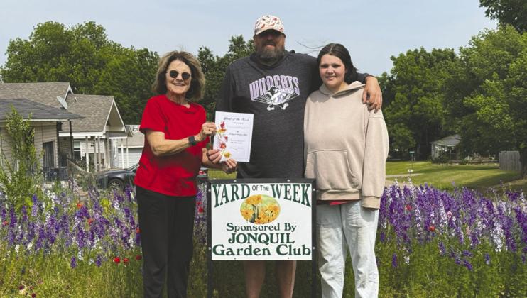 Jonquil Garden Club Yard of the week is 1324 West Washington. Pictured is Jennie Woodard, Jonquil Garden Club member and Jonah Kendall and his daughter Kaya Kendall. Submitted photo