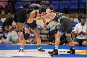 Lana Vaughn-Dock of Guthrie fighting for position against her opponent.