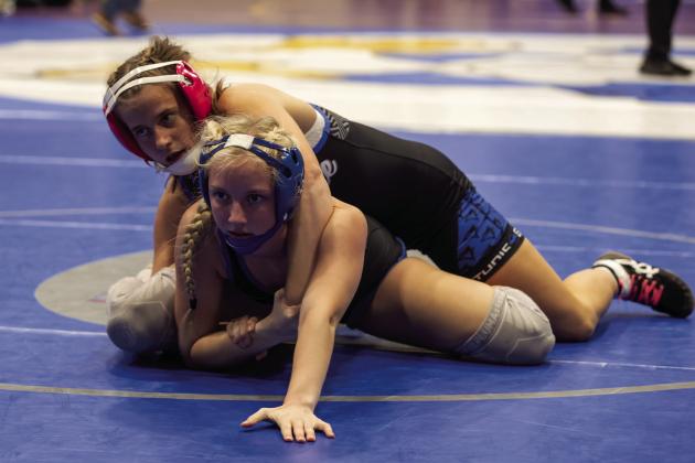Guthrie’s Bailey Hardin works on the top position during this weekend’s tournament in Guthrie.