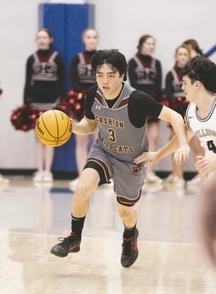 Cashion’s Parker Mitchell (3) dribbles past a Minco defender during a Class 2Aboys state tournament gameSaturday at Bridge Creek High School in Blanchard, Okla.Minco defeated Cashion 75-46