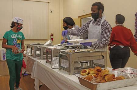 Pictured at left, The General Daniels Thanksgiving Dinner was held at the American Legion Building on November 24. The dinner in its 19th year served approximately 90 seniors at their residences and had another 200 carry outs to Guthrie Job Corps and local residents. Evelyn Nephew who with a small committee organizes the annual event as expecting around 300 dinners to be served at the hall. Photo by Mike Monahan