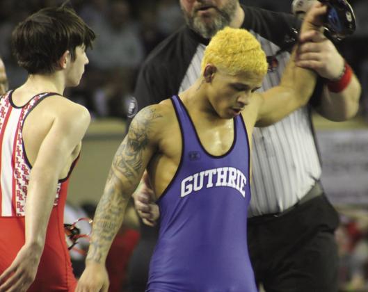 Guthrie's Kaedin Herendeen wins the 120-pound semifinal match over Bishop Kelley's Connor Chancellor at the 5A State Championships. Photo by George McCormick.